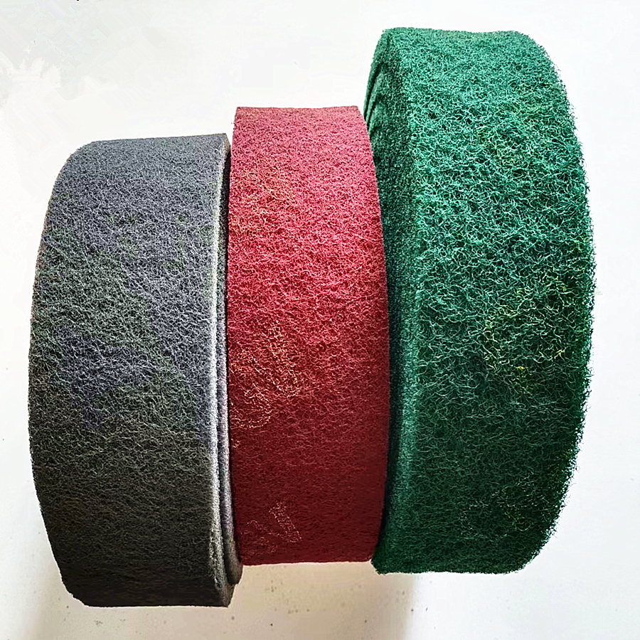 Non-woven scouring abrasive rolls